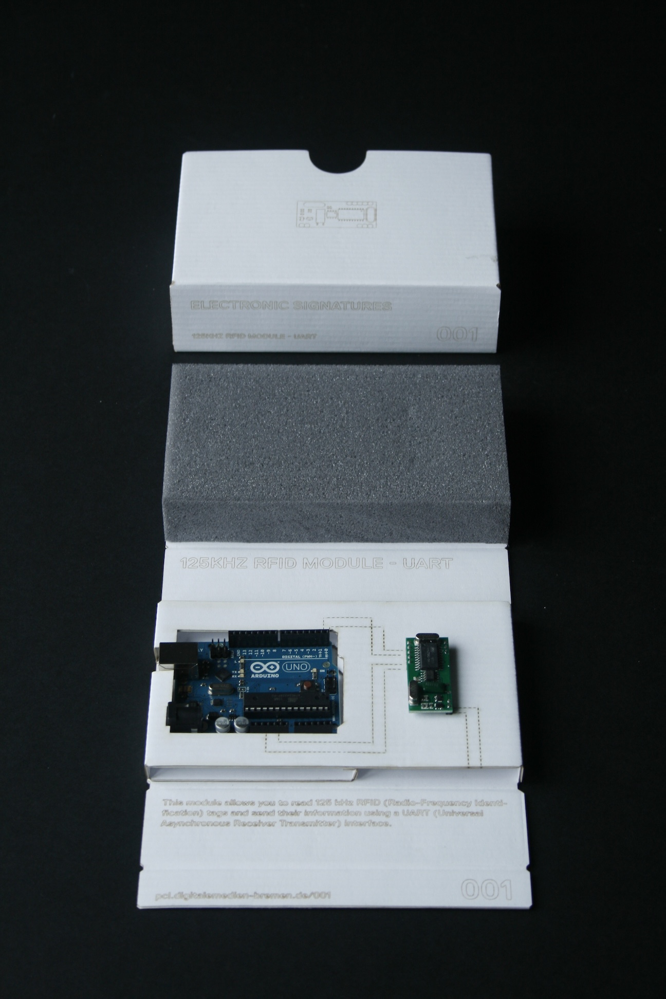 Photo of a lasercut cardboard box containing an arduino and a sensor